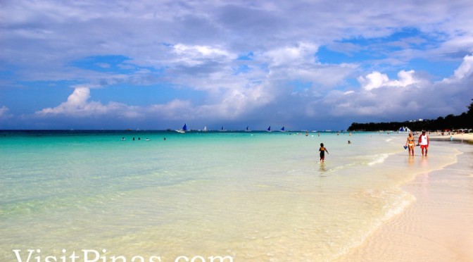 White sand, clear waters and blue sky in Boracay paradise