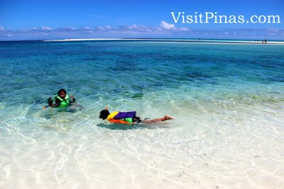 Snorkeling in clear waters at White Island, Camiguin